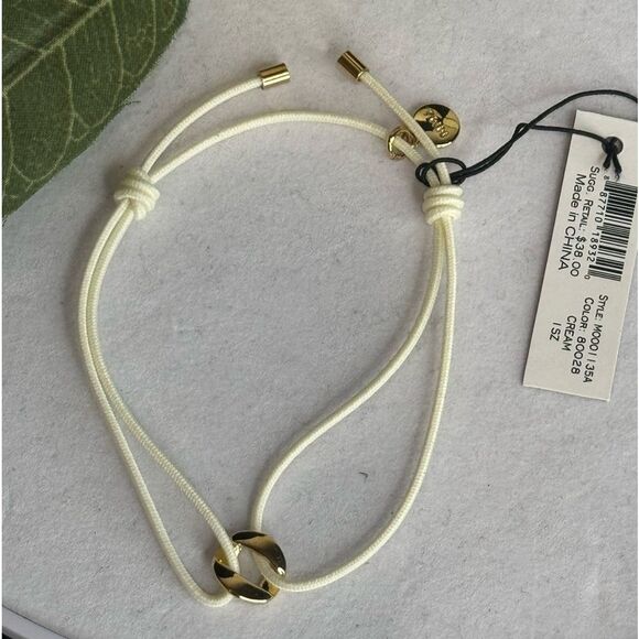 Marc By Marc Jacobs Cream String Bracelet With Gold Tone TurnLock Charm - Picture 4 of 5